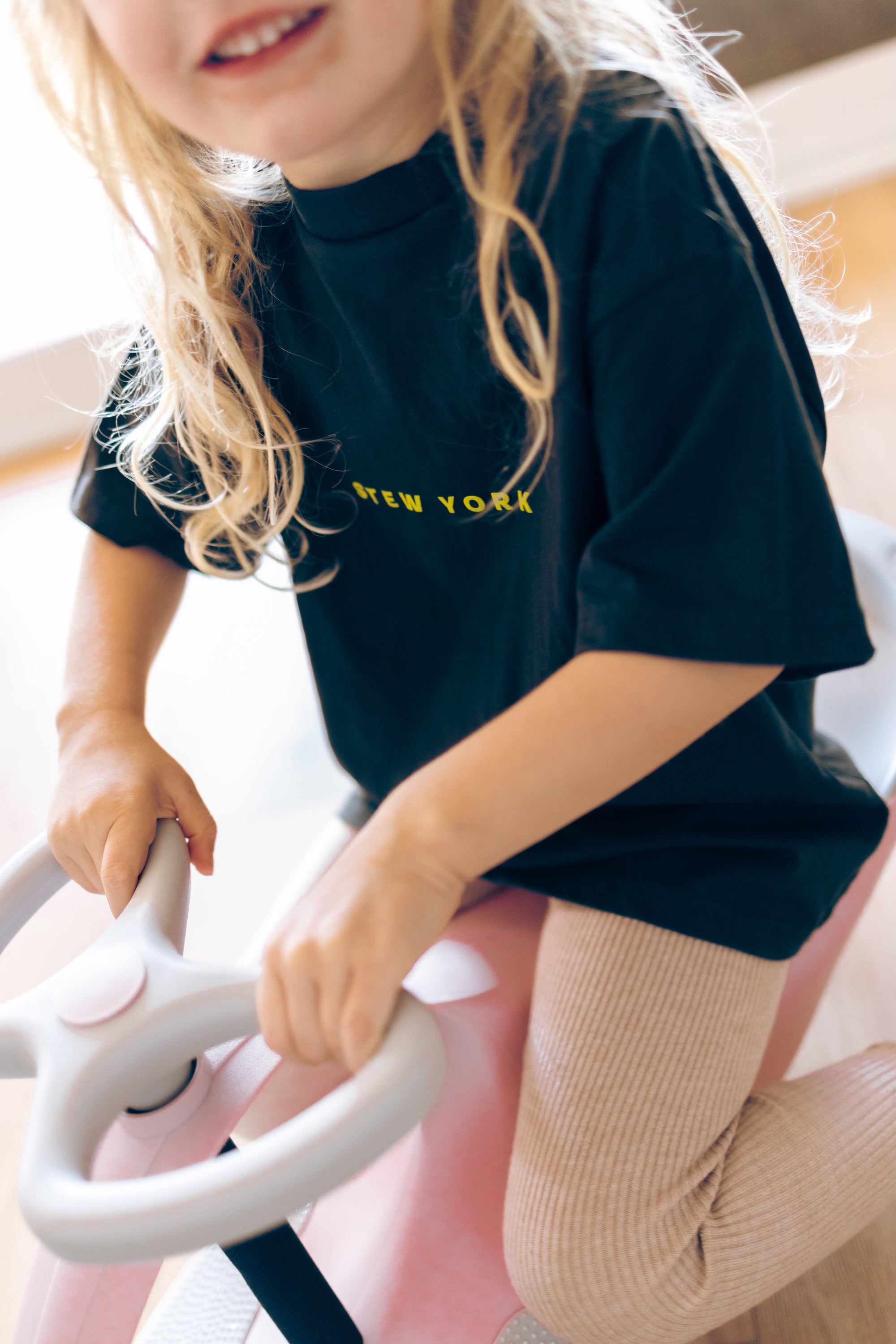 Child wearing Stew York Minute Tee