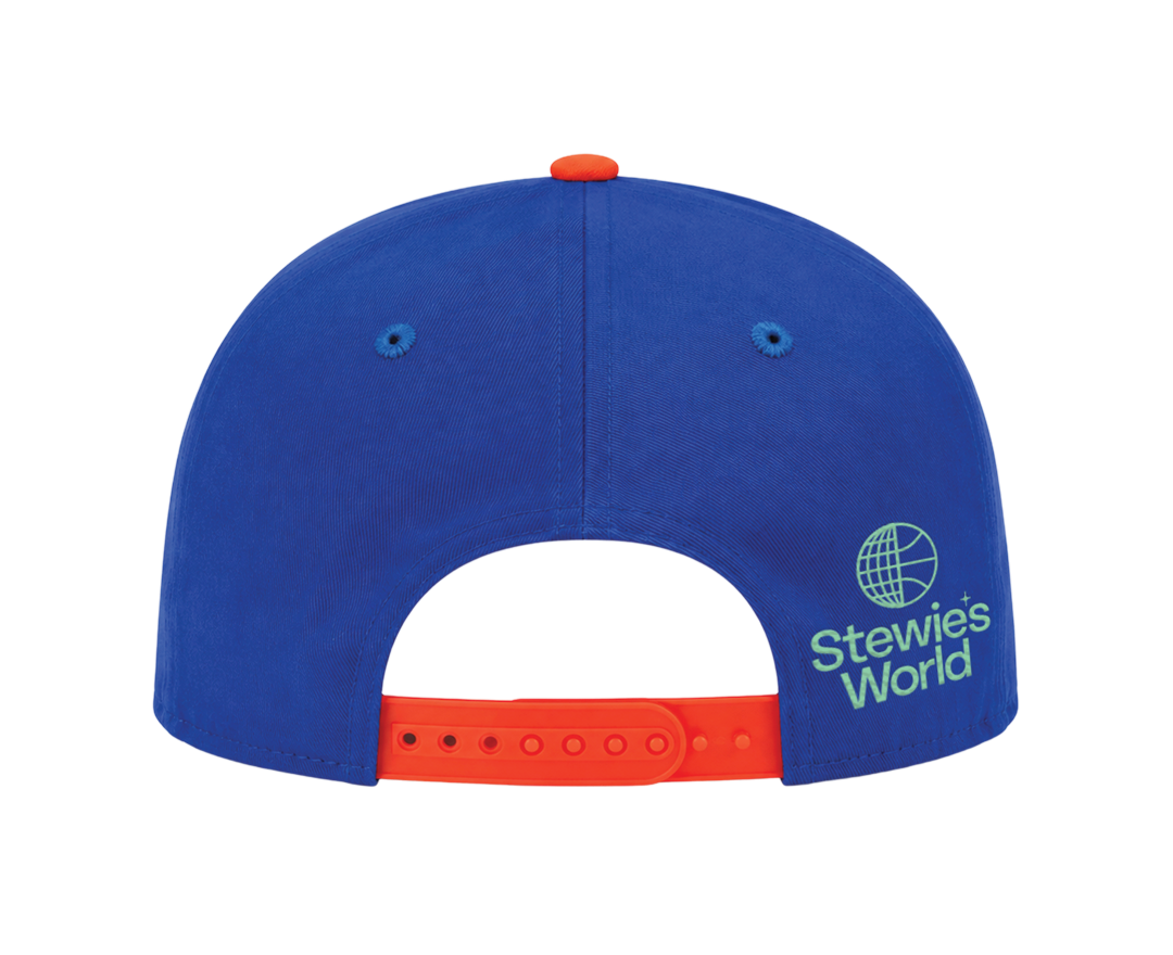 The back of a royal blue baseball cap with a bright orange adjustable strap and a white 'Stewie's World' logo on the side.